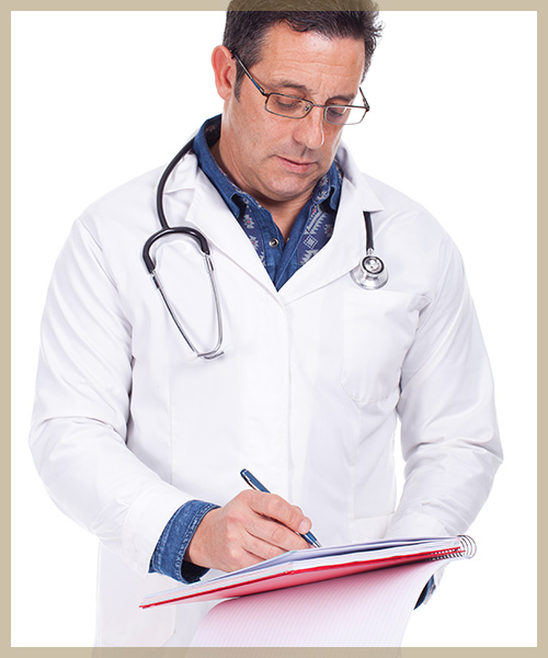 Doctor in white coat with stethoscope writing on notepad