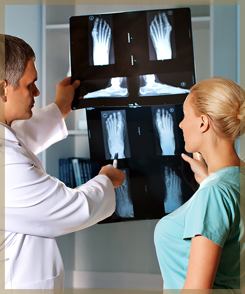 Doctor showing X-Ray of foot to patient