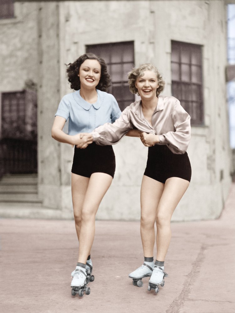 Two women roller skating 