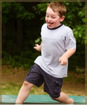 Boy running around on trampoline