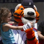Detroit Tigers mascot dancing with girl