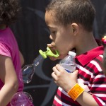 Boy blowing bubbles at Goodwin & Scieszka Law Day