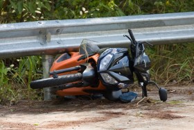 Motorcycle crashed into guardrail on side of the road