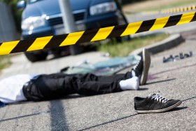 Pedestrian lying in street after being in an accident