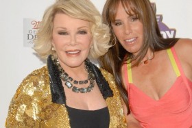 Joan and Melissa Rivers smiling on red carpet