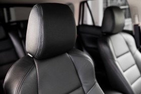 Front view of black leather car seats inside of car