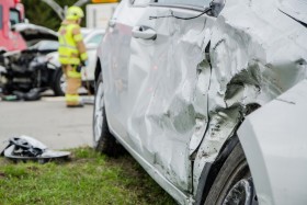 Silver car damaged from accident on front passenger side