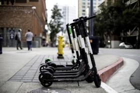 Motorized scooters lined up in downtown