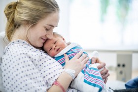 Mother holding baby in hospital after birth