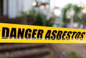 Danger Asbestos written on yellow tape