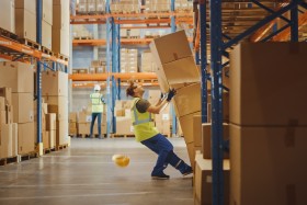 Boxes falling onto warehouse employee
