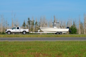 Truck towing a boat.
