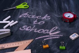A chalkboard with 'Back to School' written on it.