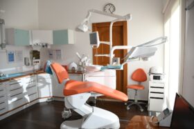 View of an empty chair in a dentist office.