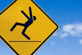Yellow sign showing a stick figure falling.