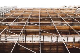 Low angle view looking up at scaffolding on a building.